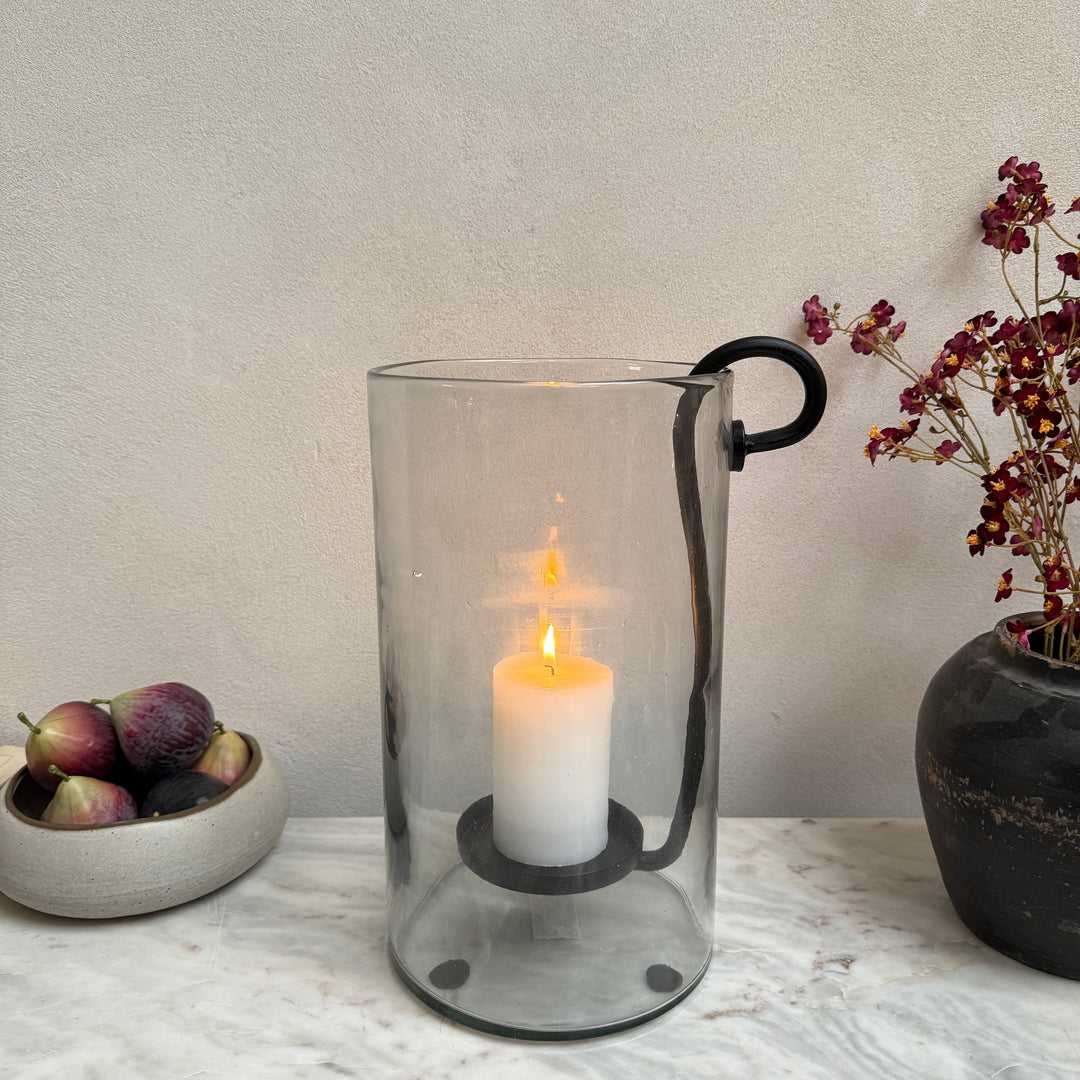 Glass hurricane lantern and candle holder