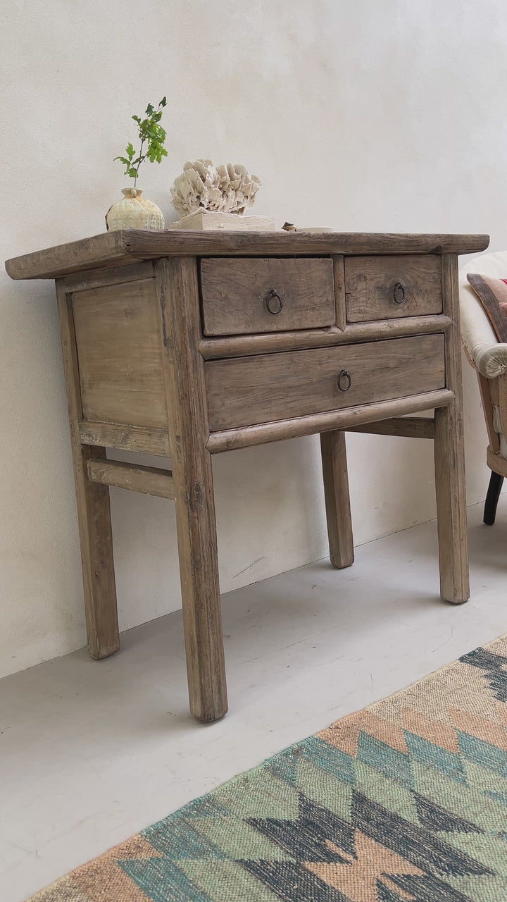 Small antique console table with drawers