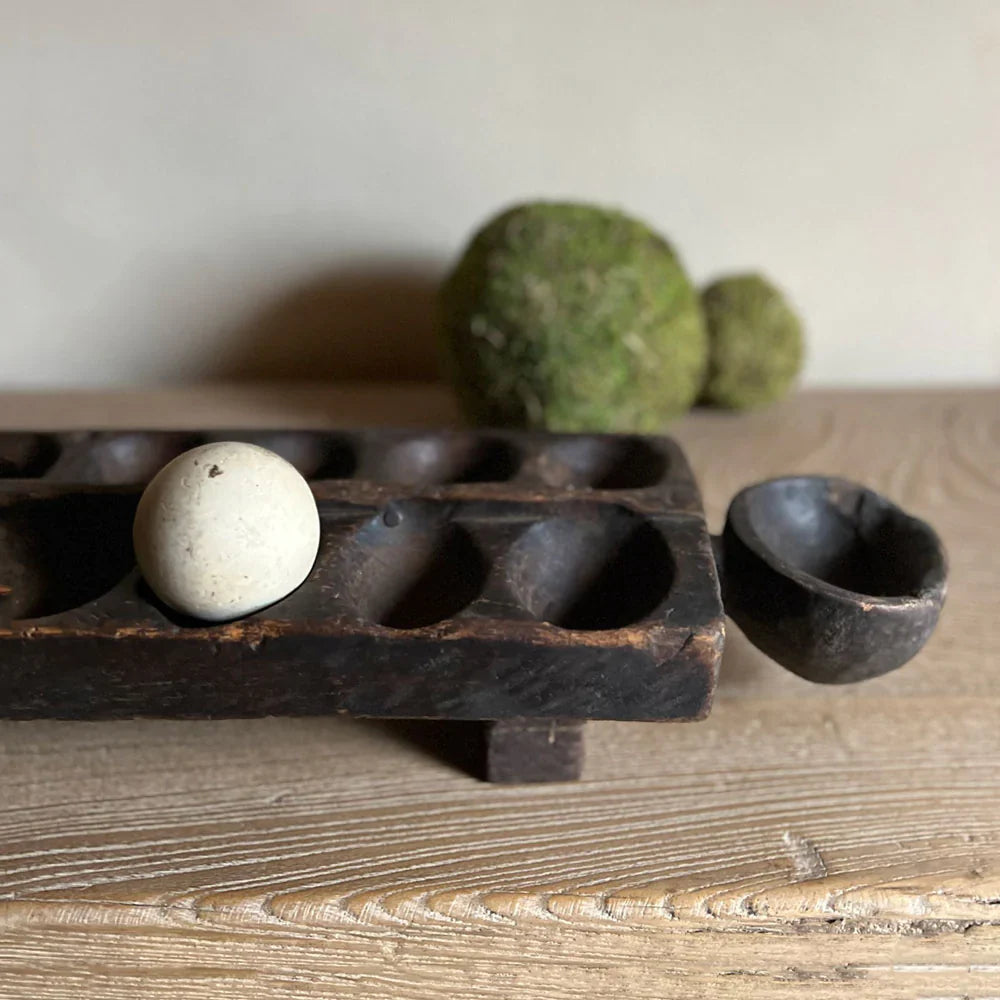 an antique board game with an antique ball inside illustrating Home Barn's range of gift ideas