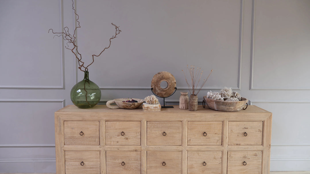 Al collection of decorative antiques and antique home accessorires on a reclaimed rustic set of drawers