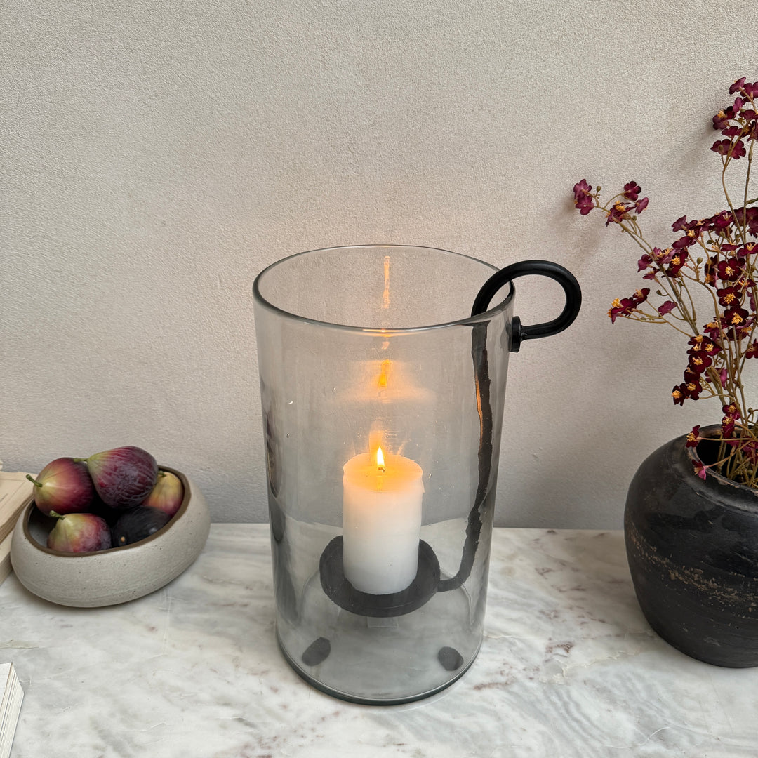Glass hurricane lantern and candle holder