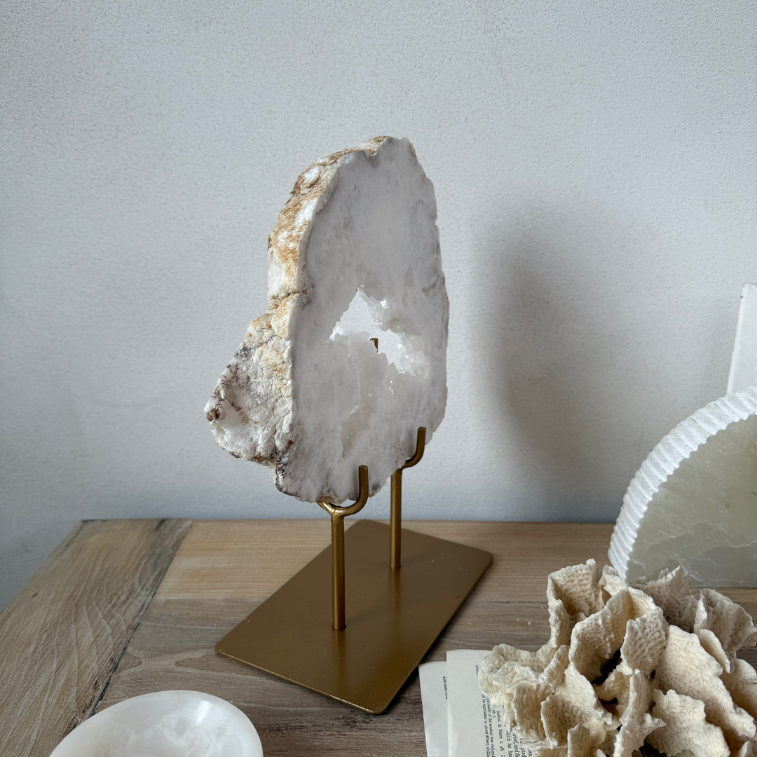 Natural crystal sculpture on stand