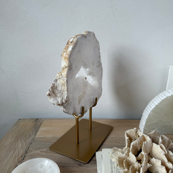 Natural crystal sculpture on stand
