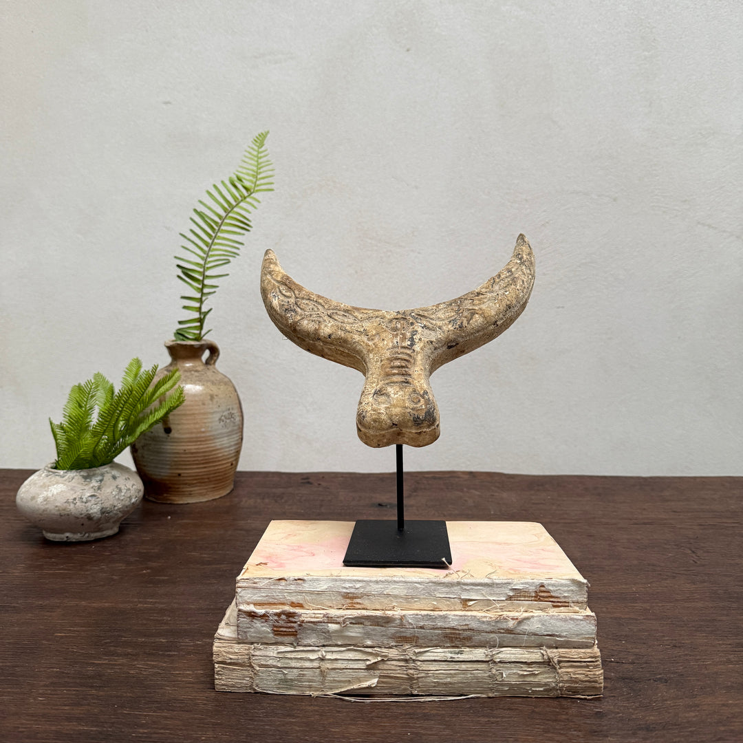 Primitive wooden cow horn sculpture