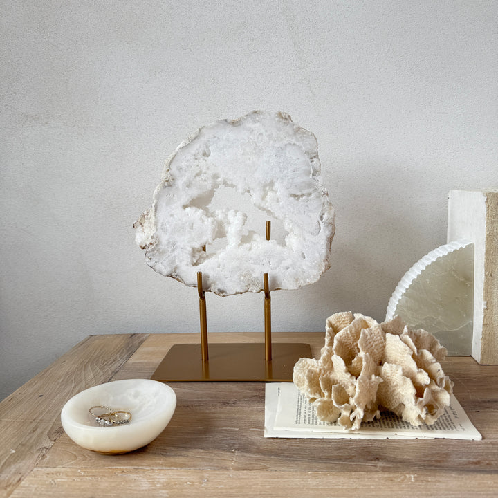 Natural crystal sculpture on stand