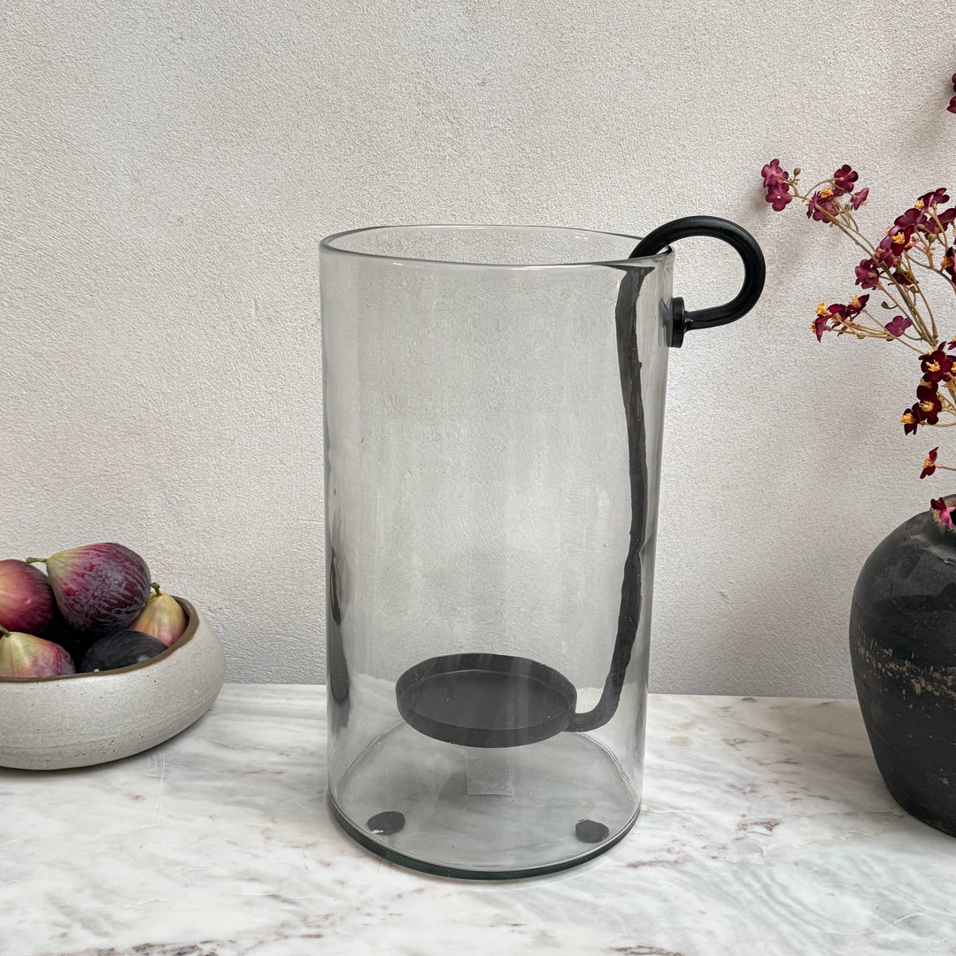 Glass hurricane lantern and candle holder