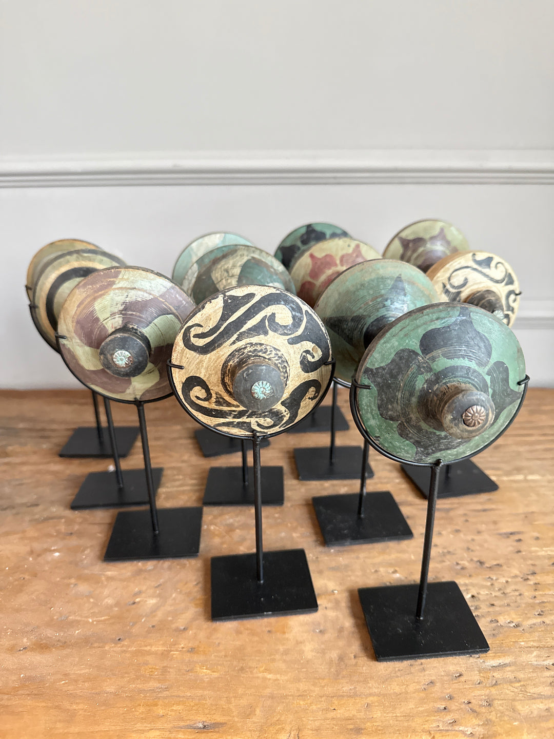 Antique small spinning top on stand