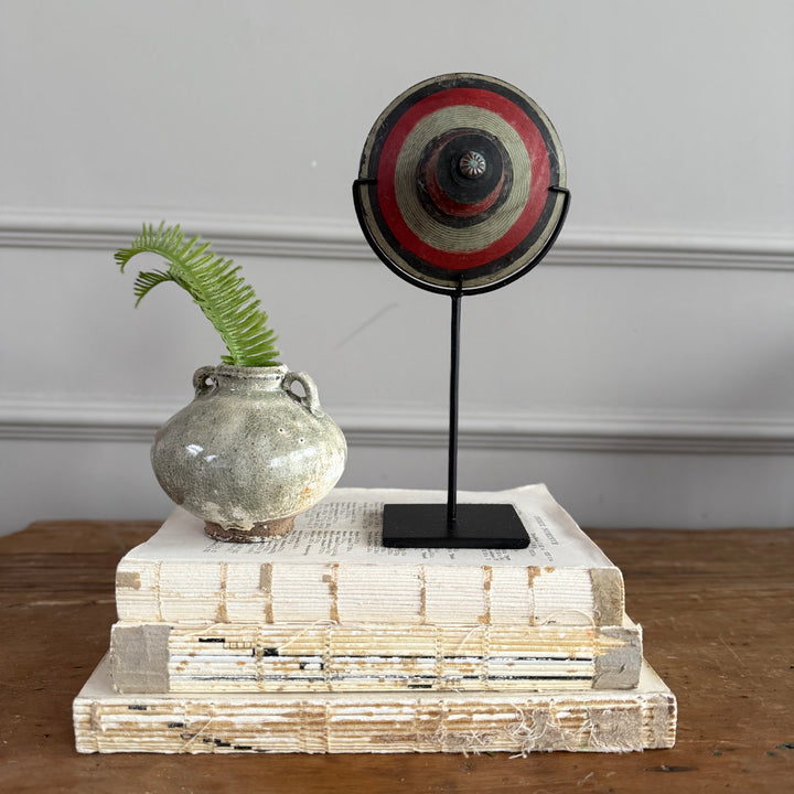 Antique small spinning top on stand