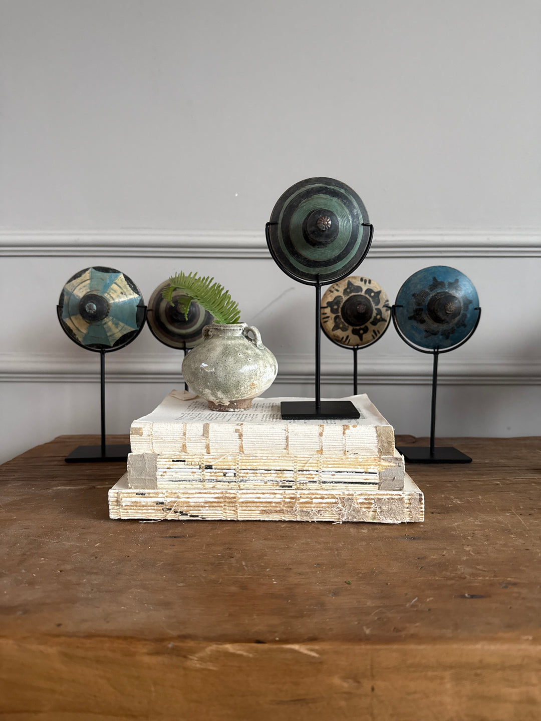 Antique small spinning top on stand