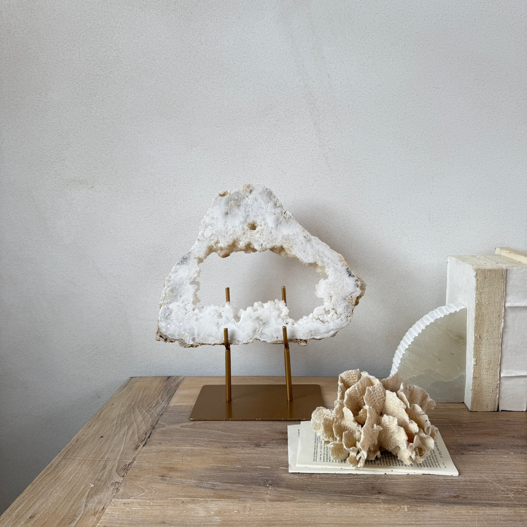 Natural crystal sculpture on stand