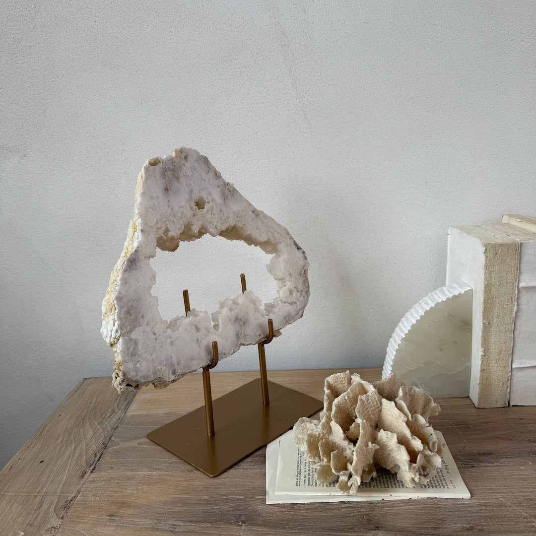 Natural crystal sculpture on stand
