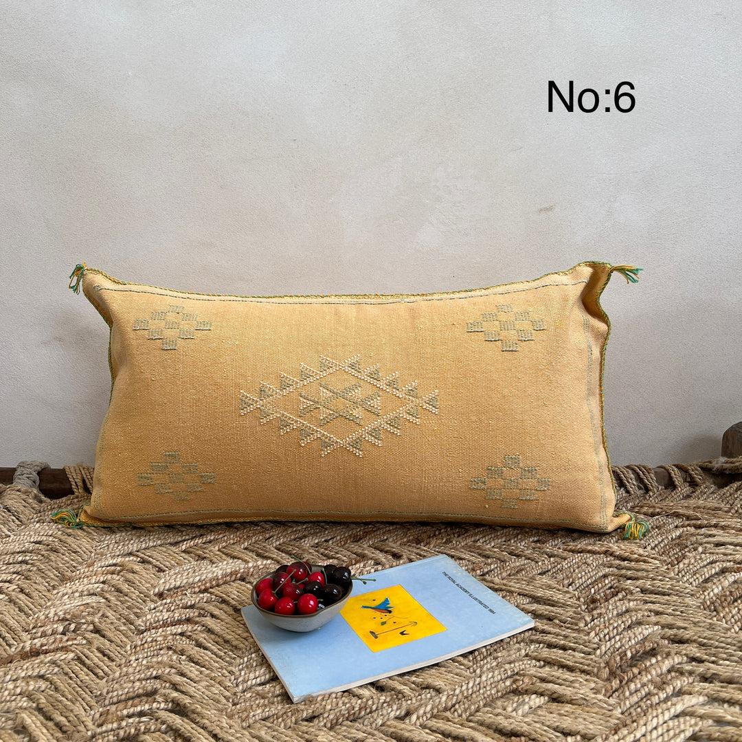 Cactus Silk Cushion - Decorative pillow with geometric pattern on a textured surface