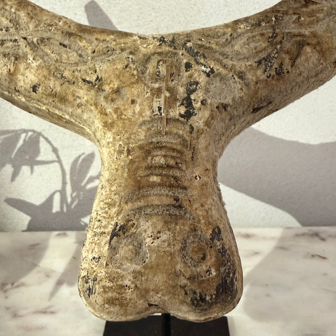 Primitive wooden cow horn sculpture