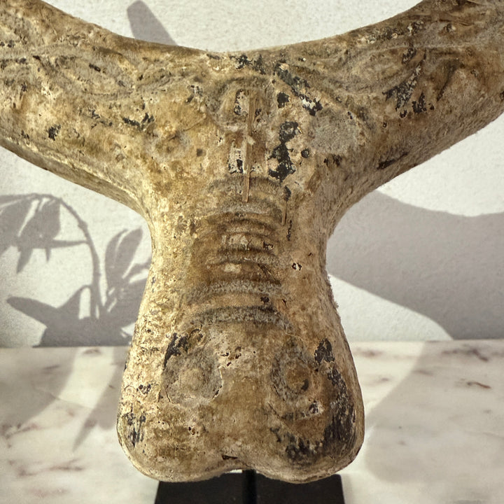 Primitive wooden cow horn sculpture
