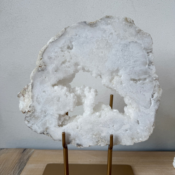 Natural crystal sculpture on stand