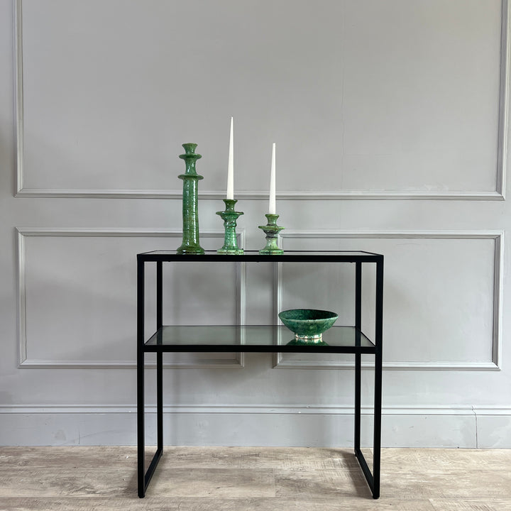 Aged Mirror Console Table styled with green moroccan tamagroute candlesticks