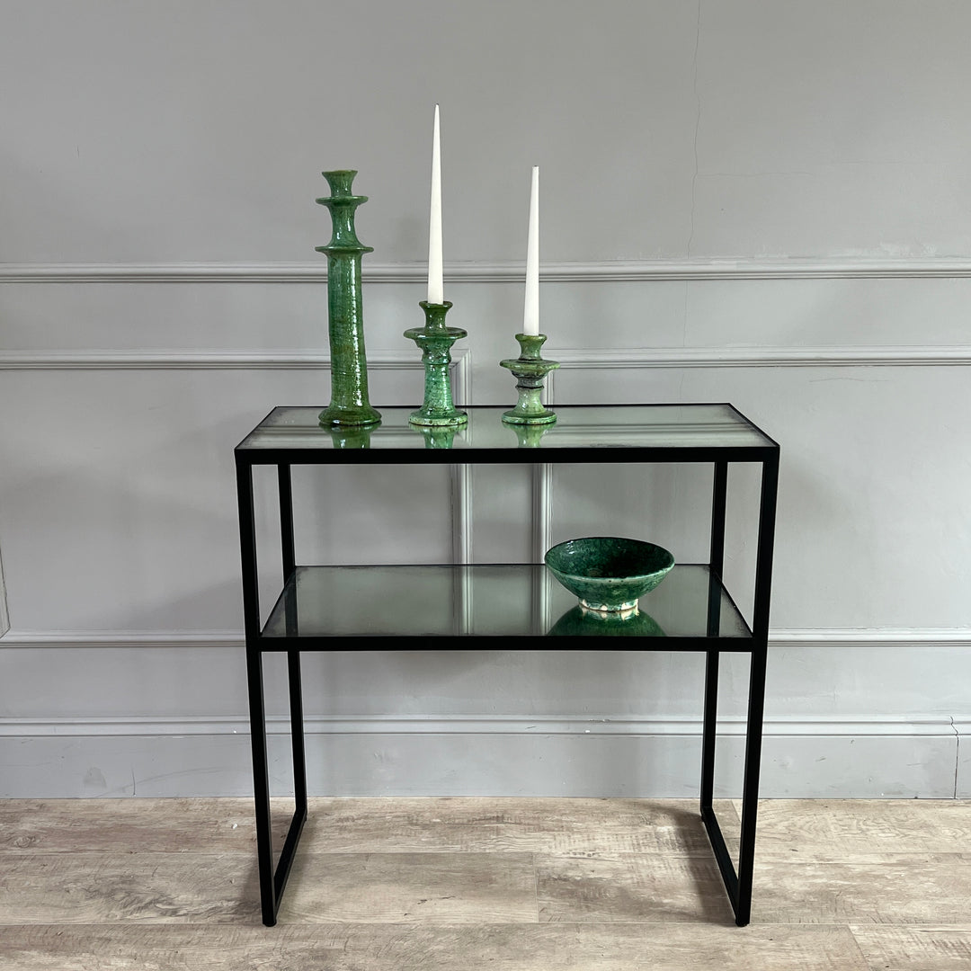 Aged Mirror Console Table styled with a trio of green Moroccan tamagroute candlesticks