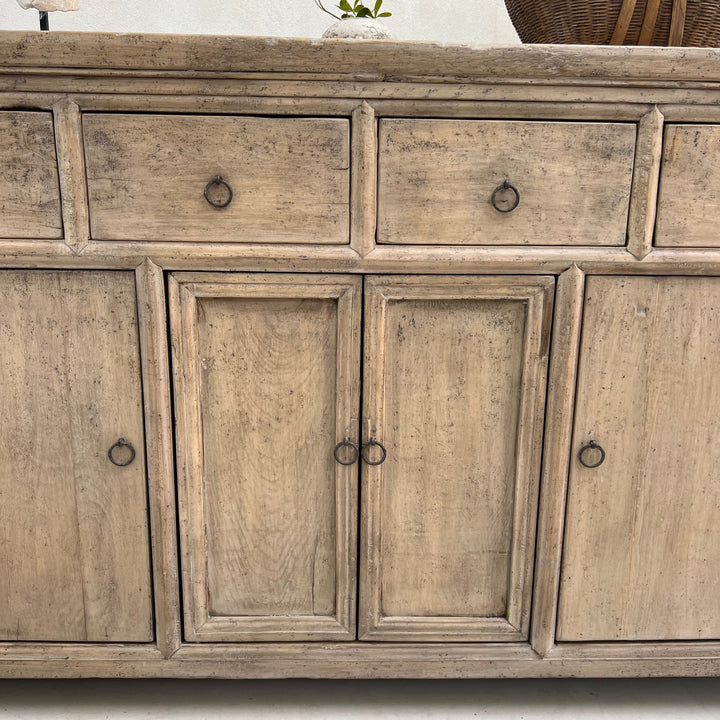 Wooden cabinet with drawers and doors on a white background