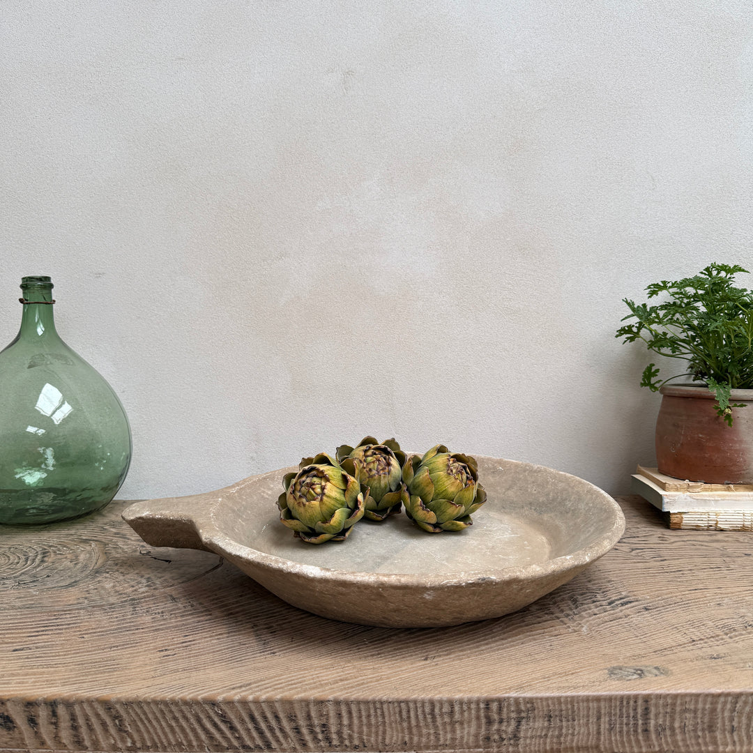 Antique Indian marble bowl hand carved from solid stone with a softly aged patina, styled as a decorative centrepiece for rustic, contemporary and wabi sabi interiors.