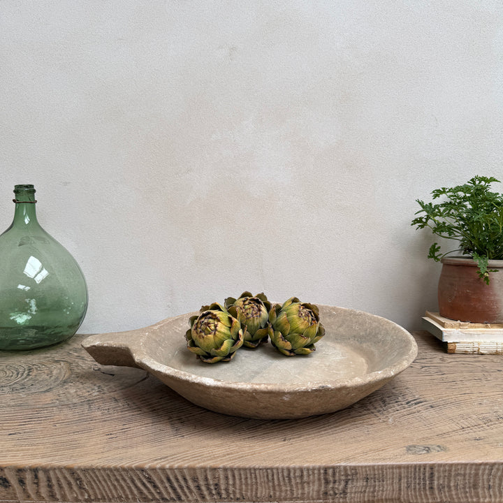 Antique Indian marble bowl hand carved from solid stone with a softly aged patina, styled as a decorative centrepiece for rustic, contemporary and wabi sabi interiors.