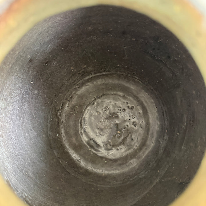 Interior view of an authentic Ming Dynasty Chinese pottery storage jar revealing traditional hand-thrown construction and centuries-old ceramic surface.
