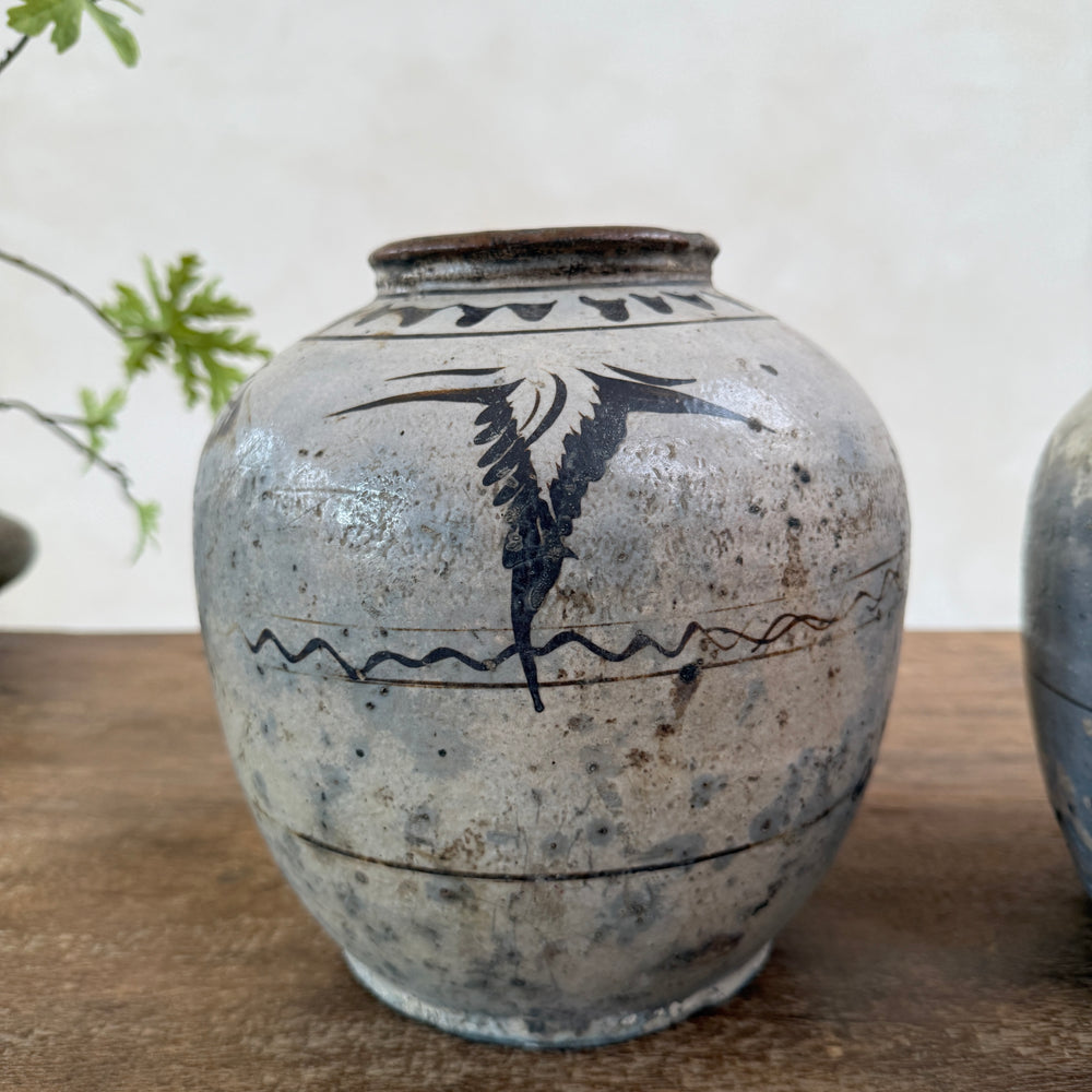 Authentic Ming Dynasty Chinese pottery storage jar featuring original hand-painted bird decoration and beautifully aged antique patina.
