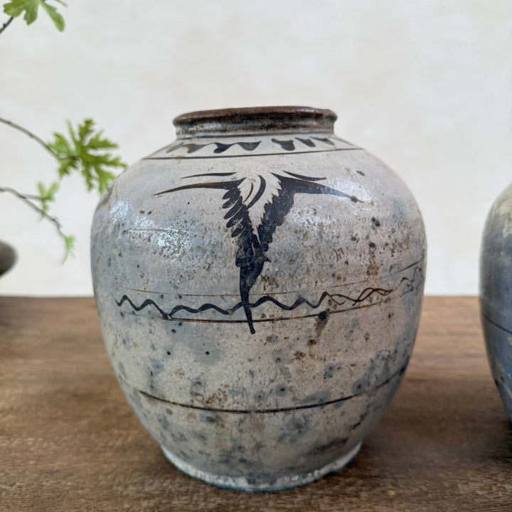 Authentic Ming Dynasty Chinese pottery storage jar featuring original hand-painted bird decoration and beautifully aged antique patina.
