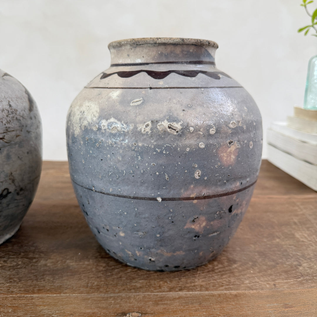 Front view of an authentic Ming Dynasty Chinese pottery storage jar with hand-painted geometric decoration and historic patina.
