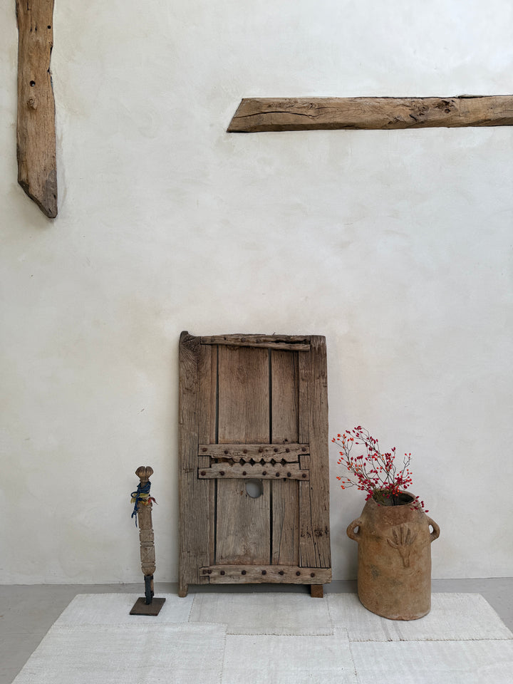 Vintage wooden tools on a white wall