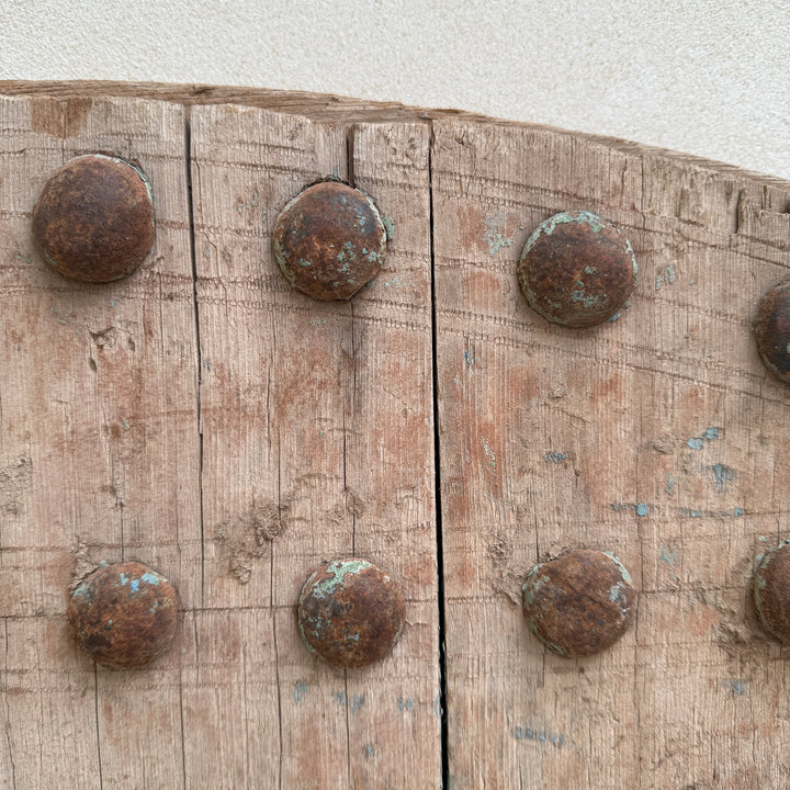 Rustic wooden surface with metal rivets