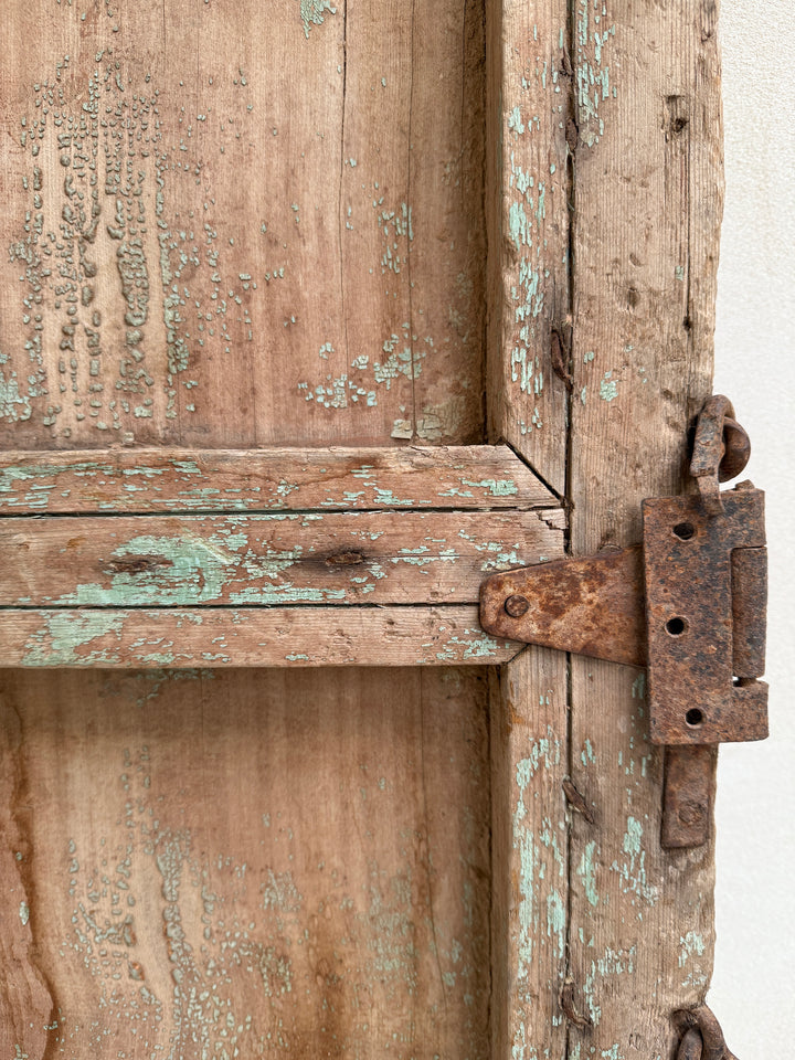 Close-up of an old wooden chest with a rusty latch