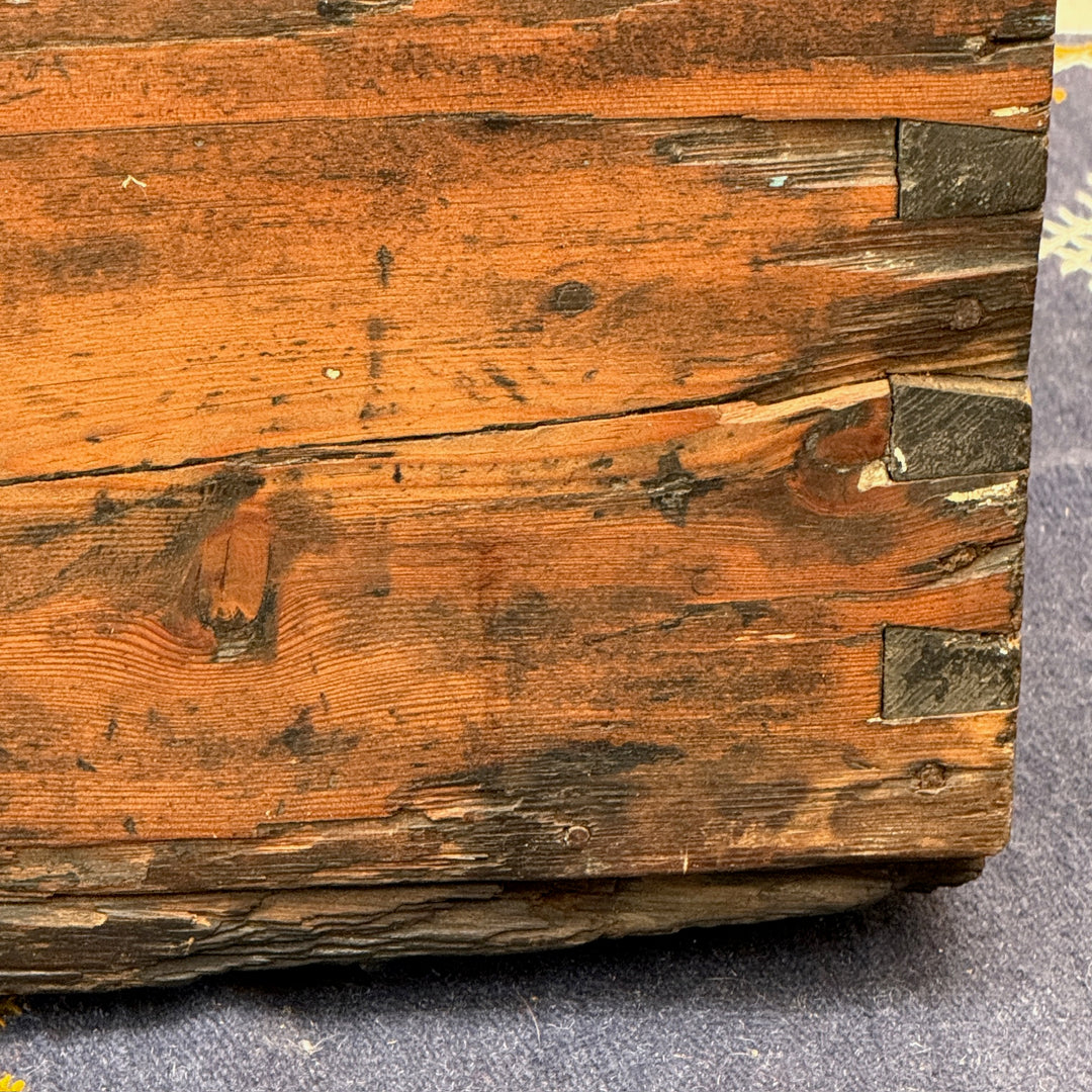 Close-up of the hand-cut dovetail joints and weathered antique pine timber on the Antique Rustic Pine Blanket Box.
