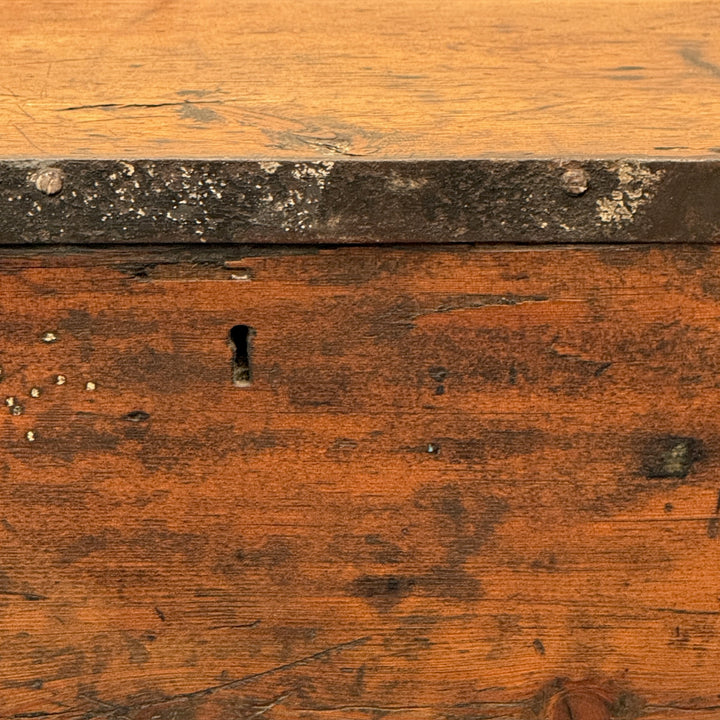 Front detail of the Antique Rustic Pine Blanket Box highlighting its rich honey-brown timber, original keyhole and naturally aged character.
