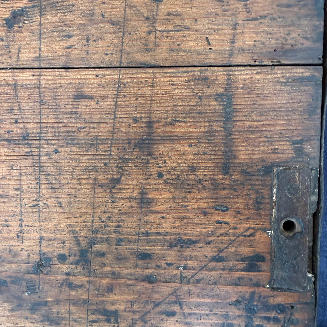 Detail of the solid pine lid showing the historic timber grain, original construction and natural patina developed over many years of use.
