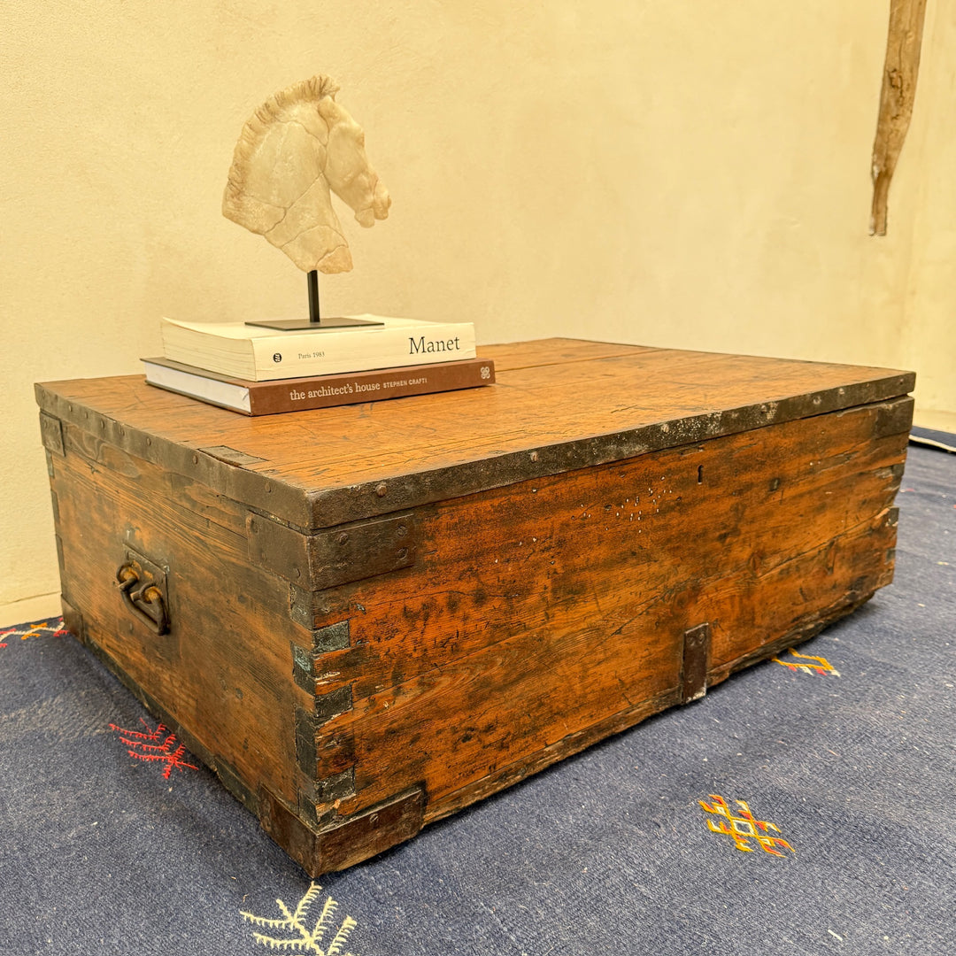 Angled view of the Antique Rustic Pine Blanket Box showcasing its substantial proportions, original iron hardware and beautifully aged pine.
