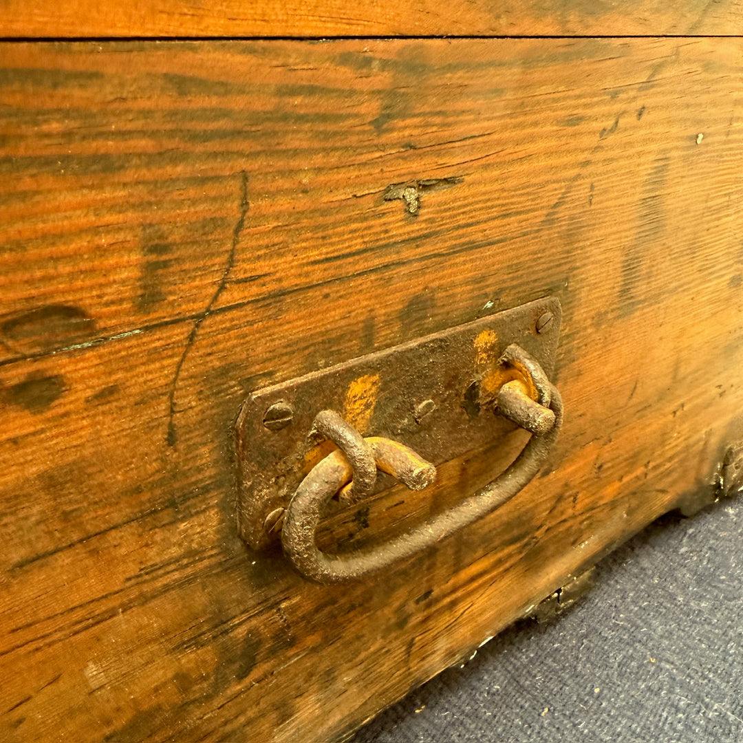 Original hand-forged iron carrying handle fitted to the Antique Rustic Pine Blanket Box, highlighting its authentic antique hardware.
