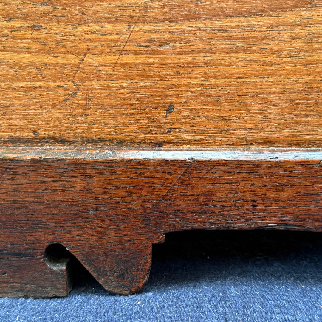 Close-up of the solid oak base and shaped plinth, highlighting the quality craftsmanship of this Victorian storage chest.
