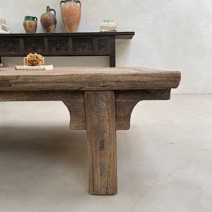 Wooden table with rustic design in a minimalistic setting