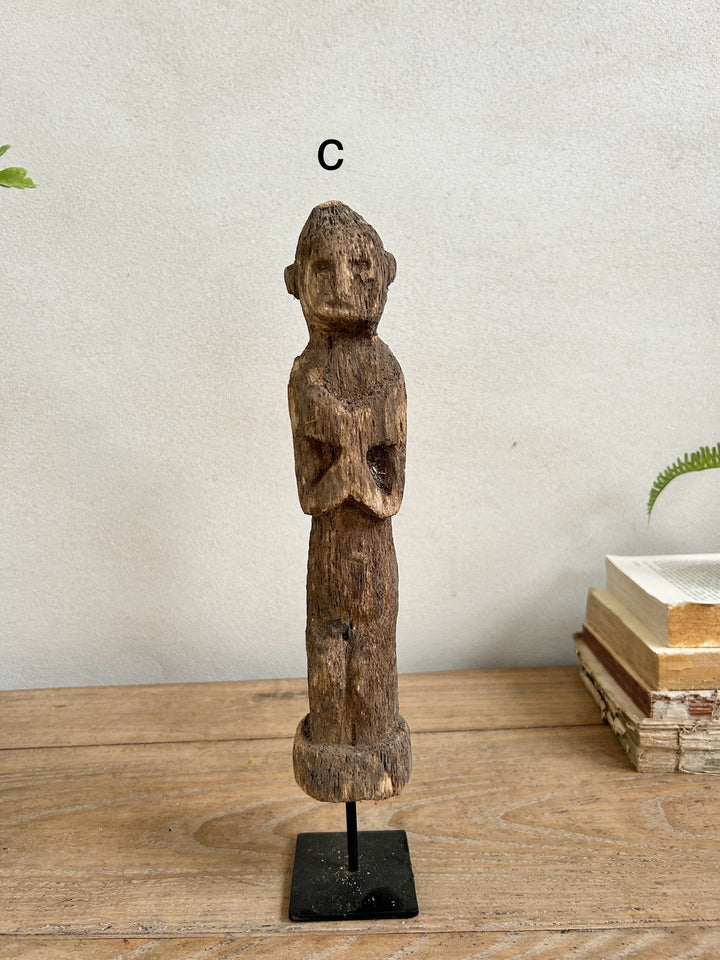 Antique hand-carved wooden statues on stand | Wira 