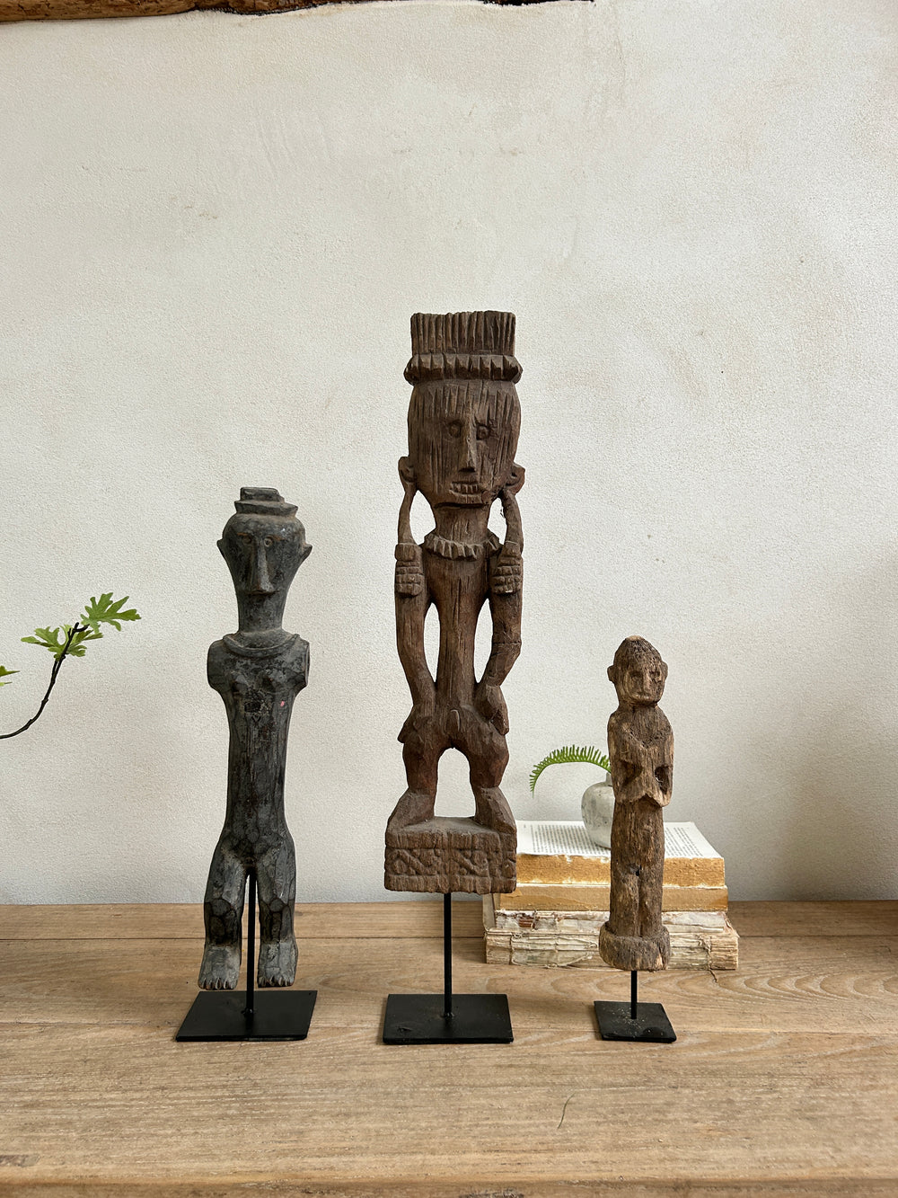 Antique hand-carved wooden statues on stand | Wira