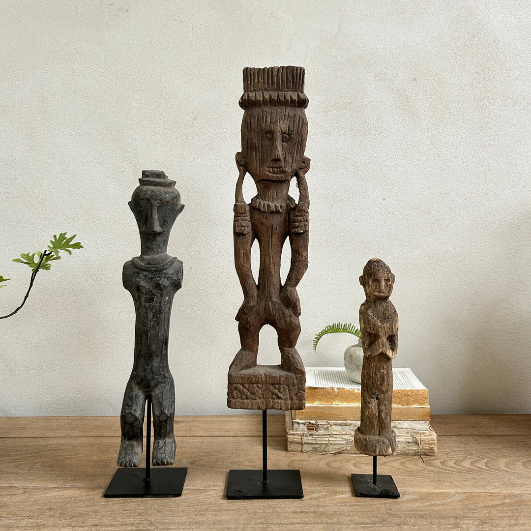 Antique hand-carved wooden statues on stand | Wira