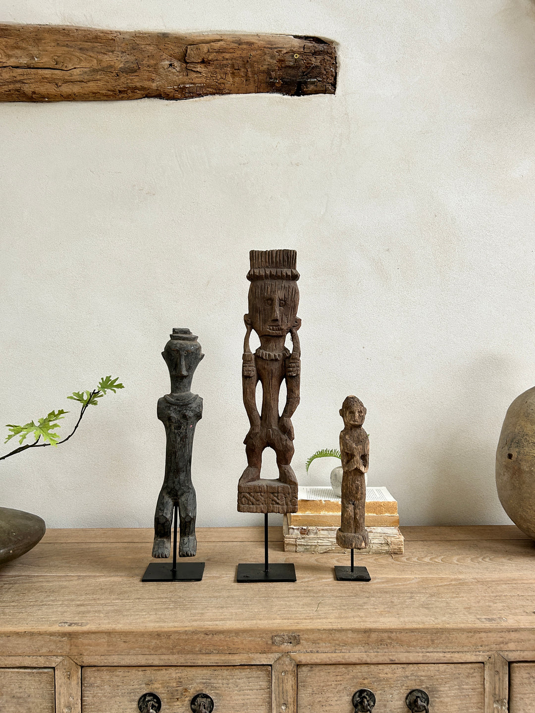 Antique hand-carved wooden statues on stand | Wira