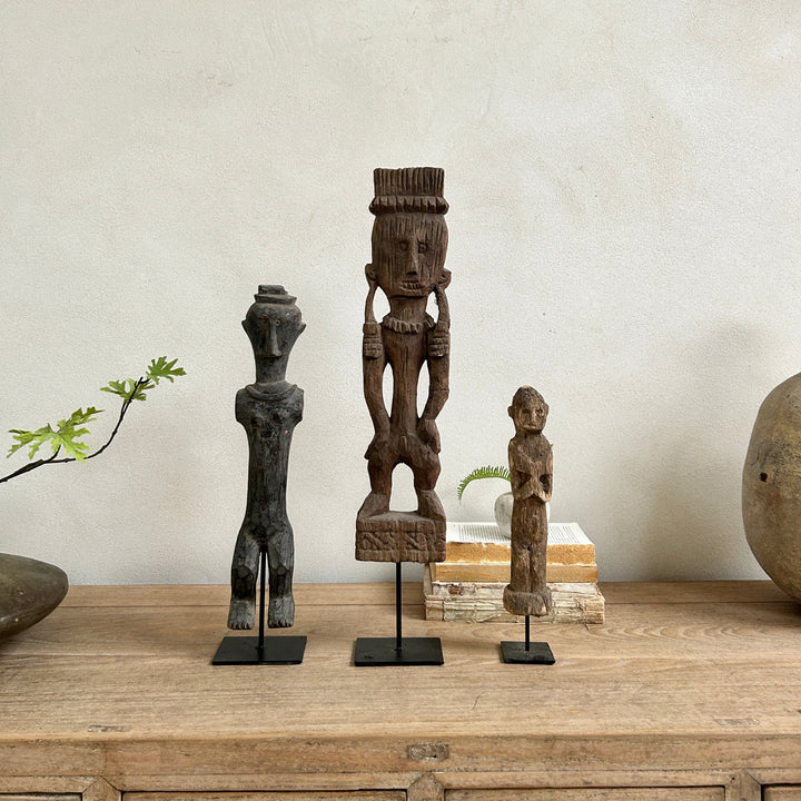 Antique hand-carved wooden statues on stand | Wira