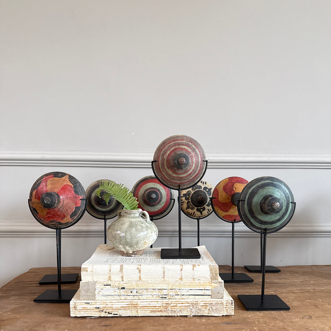 Antique small spinning top on stand