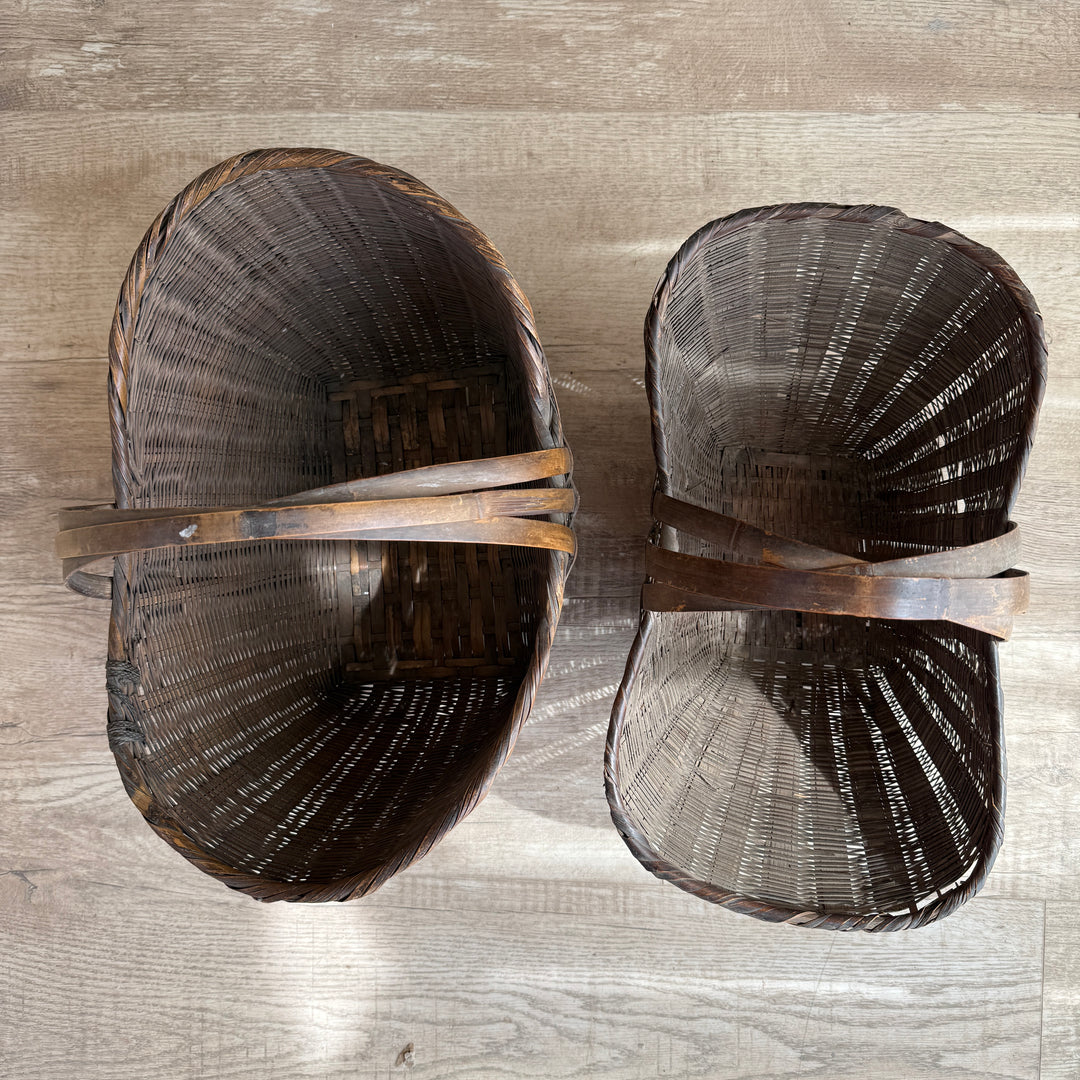 Two wooden shoes on a wooden surface