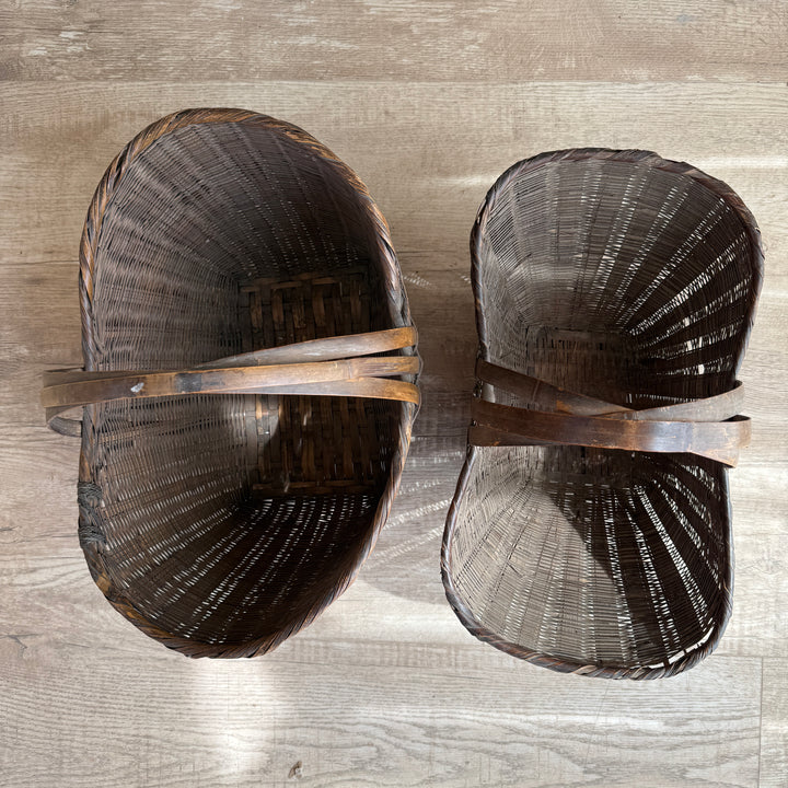 Two wooden shoes on a wooden surface