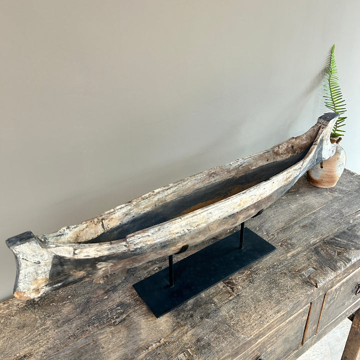 Antique wooden boat on stand | Krishna