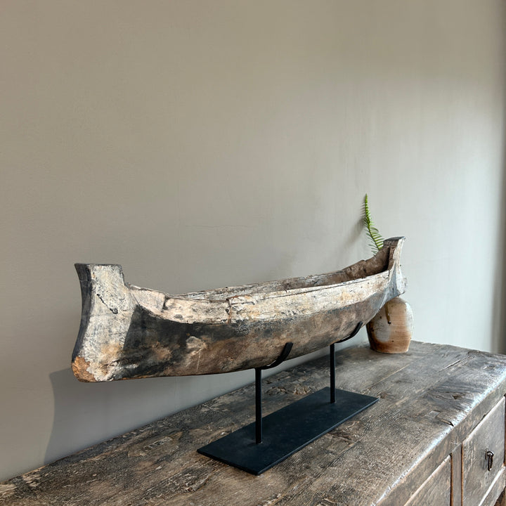 Antique wooden boat on stand | Krishna