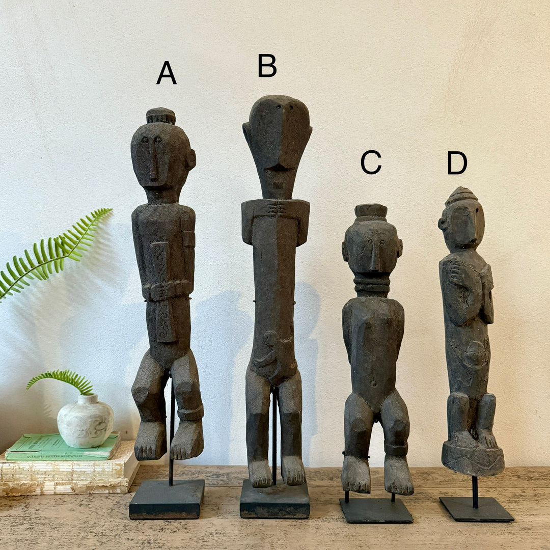 Antique wooden statues on stand | Jaya