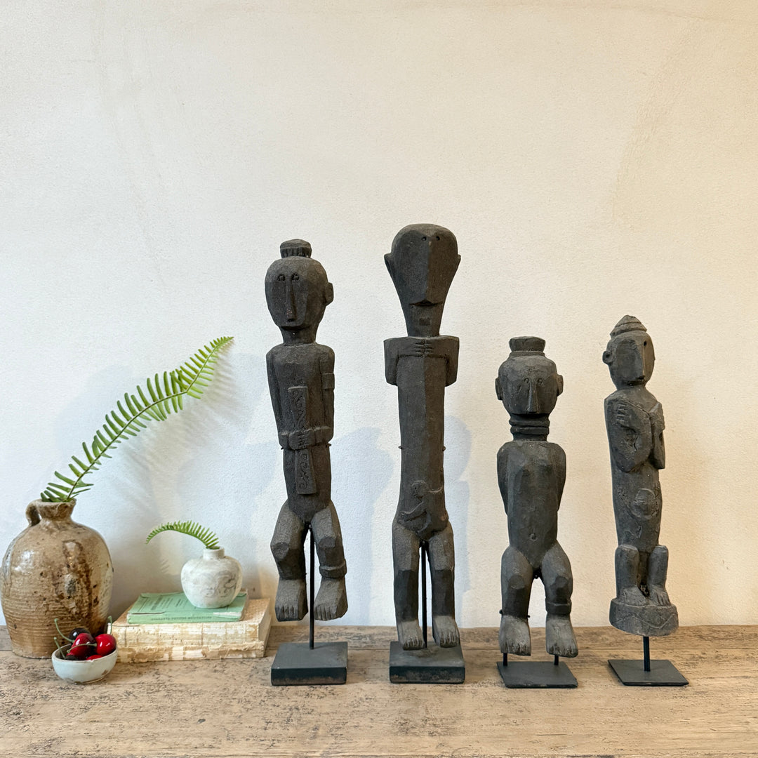 Antique wooden statues on stand | Jaya